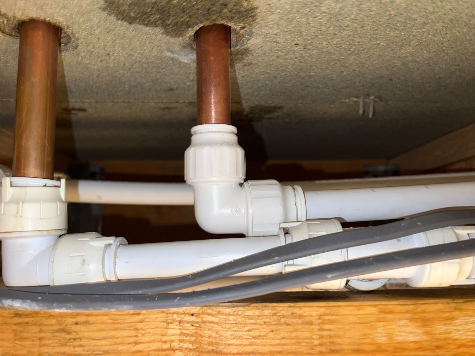 Dry, replaced push-fit fittings under the floor